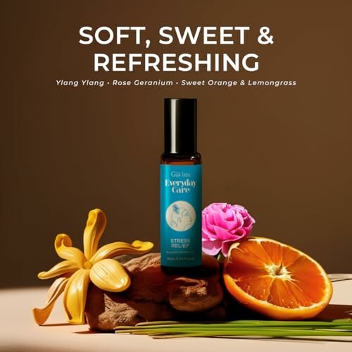 Essential oil bottle with flowers and orange slices, labeled stress relief.